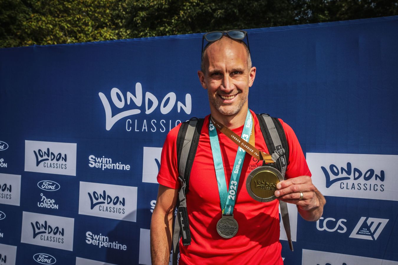 Chichester Triathlon Club member wearing a medal post event