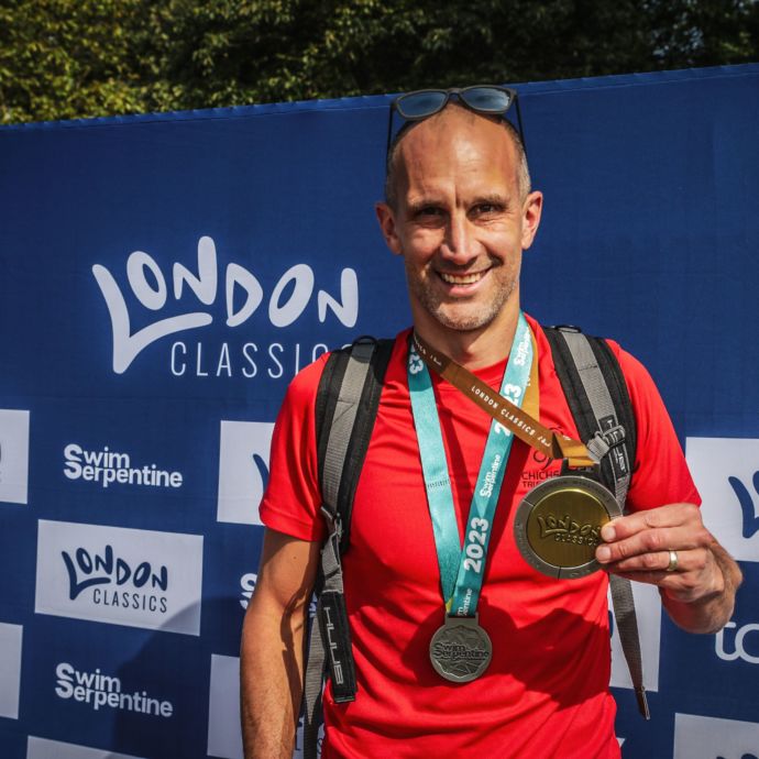 Chichester Triathlon Club member wearing a medal post event