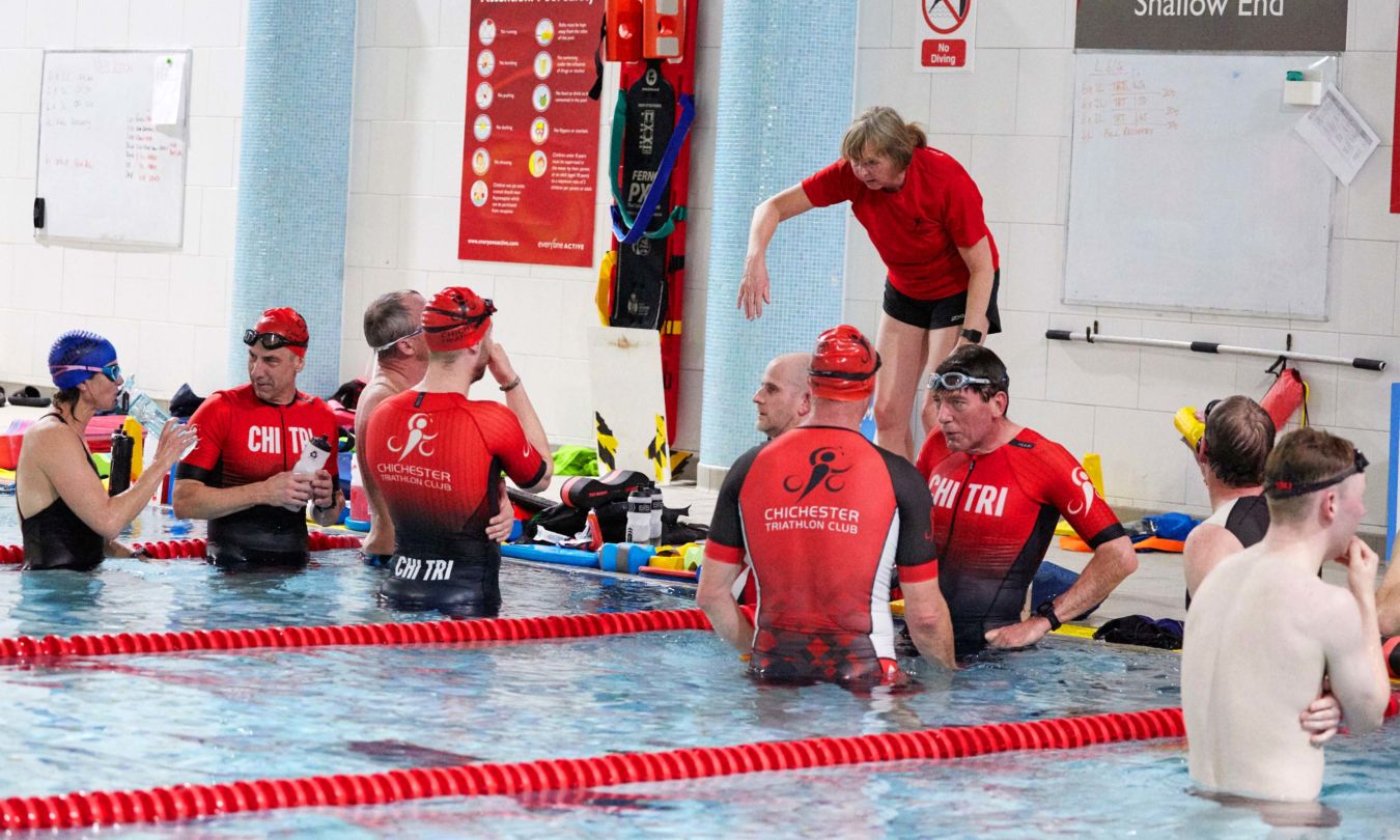 Chichester Triathlon Club coach given instruction during a swim training session