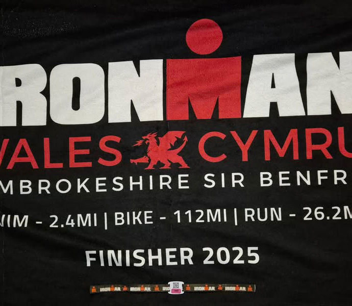Chi Tri members Ironman Wales 2025 finisher shirt close up