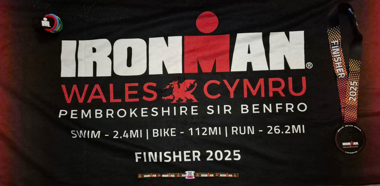 Chi Tri members Ironman Wales 2025 finisher shirt close up